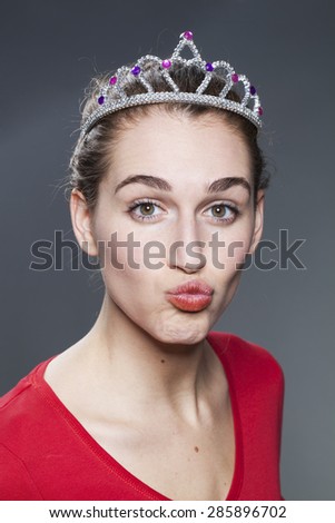 beautiful young woman playing with her mouth for romance and humor