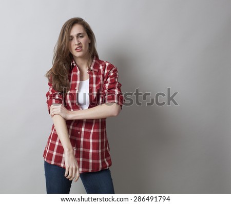 threatening woman with rolled up sleeves expressing self-assertion