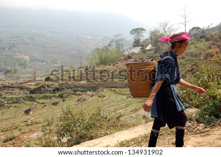 SAPA-CIRCA MARCH 2009: An unidentified Hill-Tribe Woman during a tourist trek circa March, 2009 in the hills of Sapa, Vietnam.