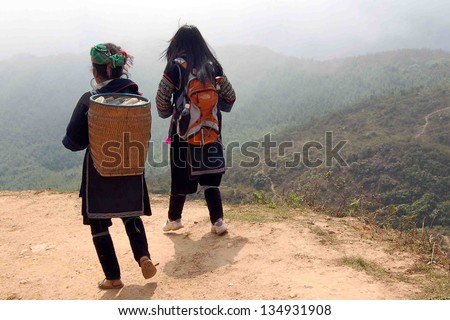 SAPA-CIRCA MARCH 2009: Unidentified Hill-Tribe Women during a tourist trek circa March, 2009 in the hills of Sapa, Vietnam.