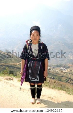 SAPA-CIRCA MARCH 2009: An unidentified Hill-Tribe Woman poses during a tourist trek circa March, 2009 in the hills of Sapa, Vietnam.