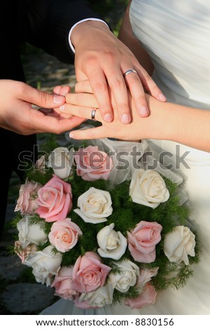 stock photo wedding rings and flowers