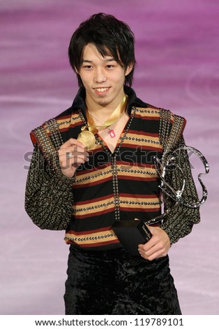 PARIS - NOVEMBER 17: Takahito MURA of Japan poses at the medal ceremony after winning gold at Eric Bompard Trophy on November 17, 2012 at Palais-Omnisports de Bercy, Paris, France.