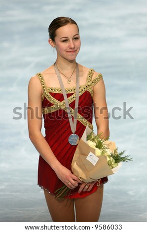 American figure skater Kimmie Meissner poses after winning a silver medal in the ladies single competition in figure skating.