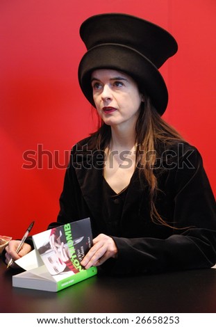 PARIS - MARCH 14: French/Belgian fiction writer Amelie Nothomb signs her  book Tokyo Fiancee at the International Book Fair - Salon du Livre 2009 on March 14, 2009 in Paris, France