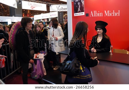 PARIS - MARCH 14: French/Belgian fiction writer Amelie Nothomb signs her  book Tokyo Fiancee and meets fans at the International Book Fair - Salon du Livre 2009 on March 14, 2009 in Paris, France
