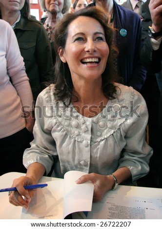 PARIS - MARCH 15: Former French socialist presidential candidate Segolene Royal dedicates her book Femme Debout (Standing Woman) during the 29th Paris' Book Fair, on March 15, 2009 in Paris, France