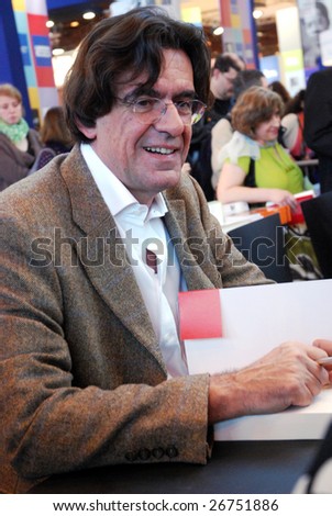PARIS - MARCH 15: French former minister of education and philosopher Luc Ferry dedicates his books at the International Book Fair - Salon du Livre 2009 on March 15, 2009 in Paris, France