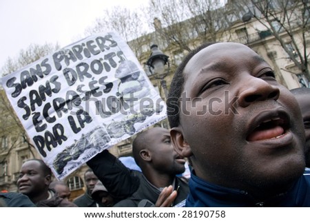 PARIS - APRIL 8: African-French protest the law, which prohibits to provide aid, charity and support to illegal immigrants on April 8, 2009 at Place St. Michel in Paris, France.
