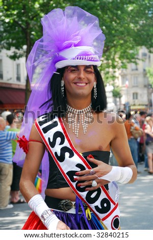 PARIS - JUNE 27: A crossdressed person smiles to the photographer at the Paris Gay Pride parade to celebrate and demonstrate diversity June 27, 2009 in Paris, France.