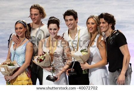 PARIS - OCTOBER 17: Winners of medals in ice dance pose at the medal ceremony of the ISU Grand Prix Eric Bompard Trophy on October 17, 2009 at Palais-Omnisports de Bercy, Paris, France.