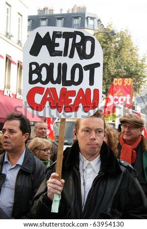 PARIS - OCTOBER 28: A man holds the poster \'Go to work, work and die\' during the strike against the retirement age reform on October 28, 2010 in Paris, France