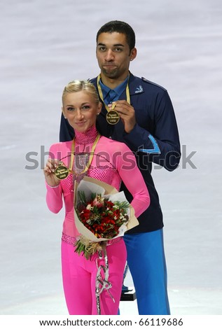 PARIS - NOVEMBER 27: Aliona SAVCHENKO/ Robin SZOLKOWY of Germany pose at the medal ceremony after winning gold at Eric Bompard Trophy on November 27, 2010 at Palais-Omnisports de Bercy, Paris, France.