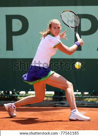 PARIS - MAY 19: Stefanie Voegele of Switzerland plays the 2nd round qualification match at French Open, Roland Garros on May 19, 2011 in Paris, France.