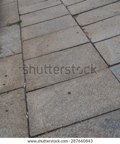 Close Up Detail of Square Stone Tiles as Part of Patio or Walk Way, Leading Away into the Distance