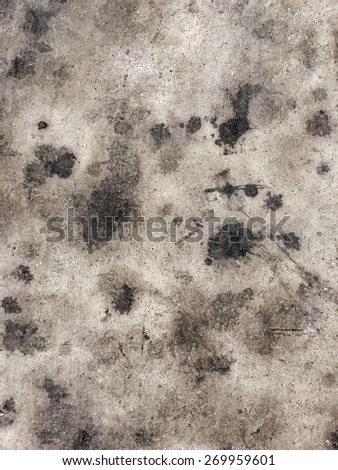 Black oil stain on the floor