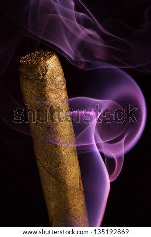 cigar, wisps of smoke on a black background