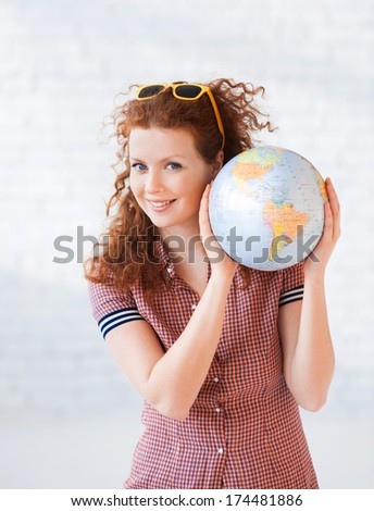 Young woman holding globe Young woman holding globe