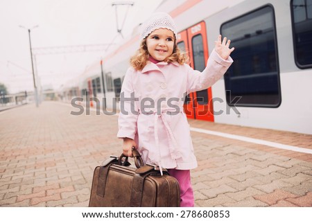 Little girl traveling with her baggage