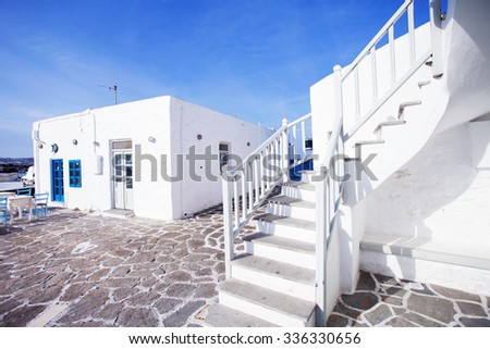 Typical traditional beautiful Greek street in white and blue style, Naousa town on Paros island, Greece