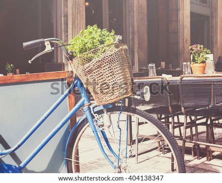 Old bicycle with a basket on a city street