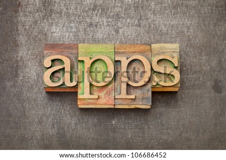 apps (applications) - software  concept - text in vintage letterpress wood type against grunge metal surface