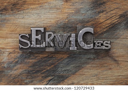 services - word in vintage letterpress metal type blocks on a grunge painted wood