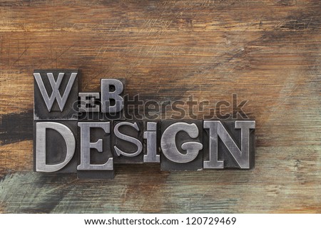 web design - text in vintage letterpress metal type blocks on a grunge painted wood