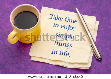 Take time to enjoy simple things in life - handwriting on a napkin with a cup of coffee against colorful textured paper