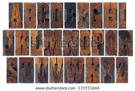 alphabet in vintage letterpress wood type blocks, French Clarendon font popular in western movies and memorabilia, a collage of 26 isolated letters
