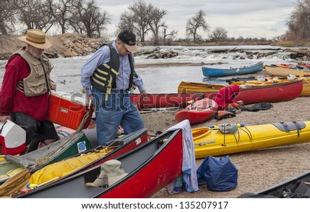 SOUTH PLATTE RIVER, EVANS, COLORADO - APRIL 6: Paddlers are taking a lunch break during Annual All Club Paddle on April 6, 2013. It is a popular season opening paddling trip in northern Colorado.