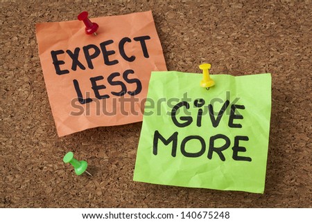 expect less, give more - motivation or self improvement concept - handwriting on colorful sticky notes