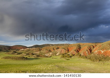 heavy storm clouds over mountain ranch - Red Mountain Open Space near Fort Collins, Colorado, spring scenery
