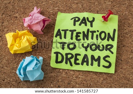 pay attention to your dreams - motivation or self improvement concept - handwriting on colorful sticky notes
