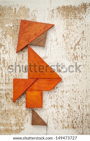 obesity concept - abstract figure of a fat man built from seven tangram wooden pieces, a traditional Chinese puzzle game