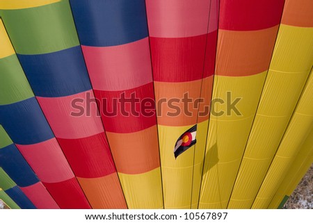 multicolor hot air balloon with Colorado flag - colorful background