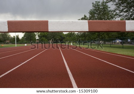 read running tracks with a steeplechase  barrier across them, low angle view