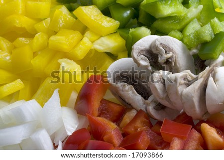 red, green, yellow pepper, white onion and mushroom diced and ready for cooking - colorful and healthy background