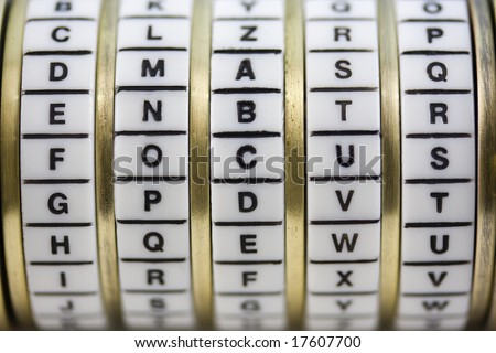 focus word set up as a password to combination puzzle box (cryptex) with rings of letters; shallow depth of field, white background, copy space