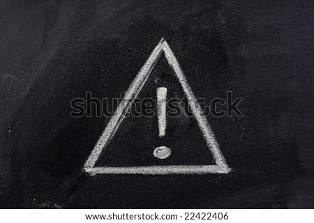 warning sign, exclamation mark inside a triangle, sketched with white chalk on blackboard
