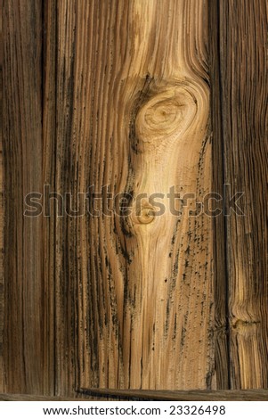 old barn weathered wood background with strong grain pattern and knots