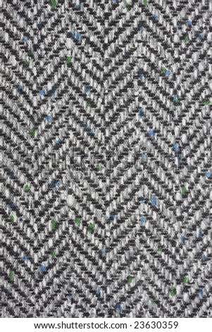 tweed textile background with herringbone pattern from a vintage book cover