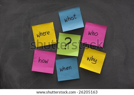 a simple mind map with questions (what, when, where, why, how, who)  to solve a problem posted with colorful sticky notes on blackboard