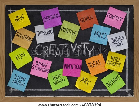 creativity concept - related cloud of words, color sticky notes and white chalk handwriting on blackboard