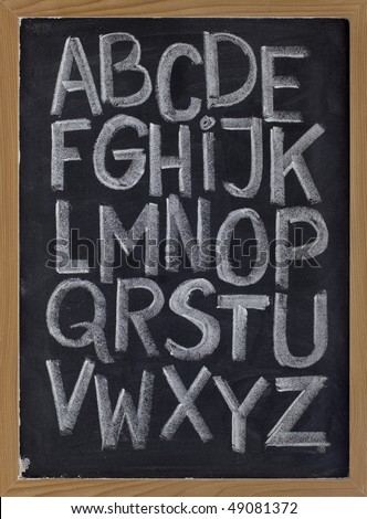 twenty six letters of English alphabet (upper case) - white chalk handwriting on blackboard