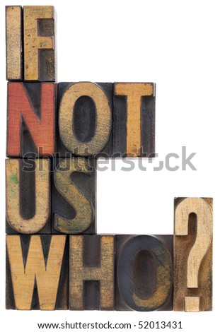 if not us, who - question or call for action, vintage wood letterpress type blocks, stained by ink, isolated on white
