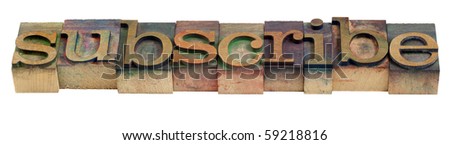 subscribe word in vintage wooden letterpress printing blocks stained by color inks
