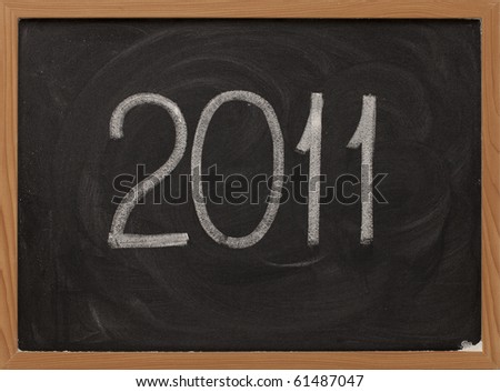 2011 new year handwritten with white chalk on blackboard