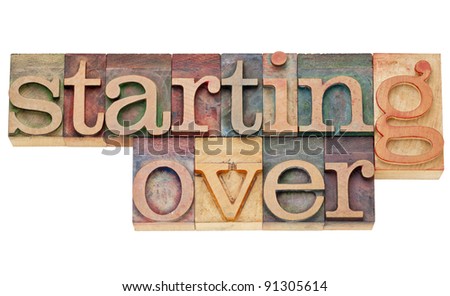 starting over - isolated text in vintage wood letterpress printing blocks stained by color inks
