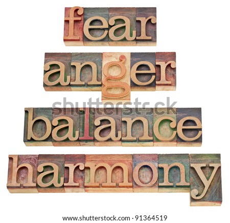 fear, anger, balance, harmony - progression of feelings or state of mind - a collage of isolated words in vintage wood letterpress type, stained by color inks